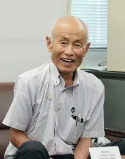 記者会見に同席した被団協の箕牧智之代表委員=18日午後、広島県庁